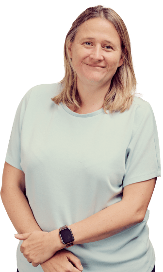 lady in white t-shirt smiling staring at camera